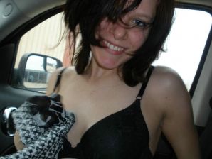 Young undresses in the car and shows bare breasts. Thumb 3